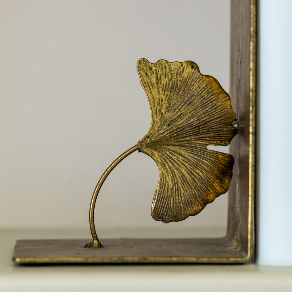 Detail shown on the left hand gold lotus leaf bookend