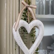 Chunky wooden hanging heart home decor. Perfect accessory for modern country, farmhouse interiors.  Add foliage with a ribbon to suit the season or simply enjoy as it is.  Shown here with season ribbon and eucalyptus foliage. Perfect home accessory. Great Country inspired home accessory. Great gift idea for country home interior fans.