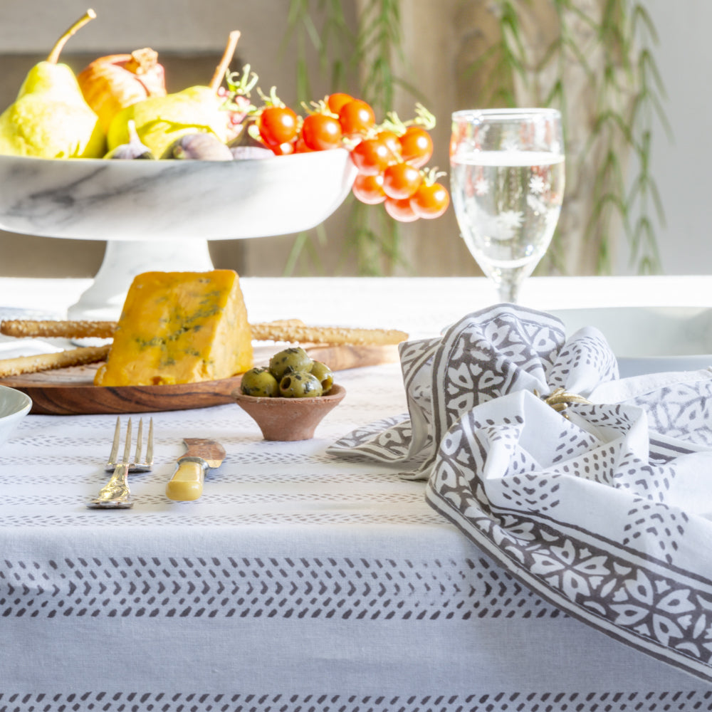 100% cotton hand block printed table cloth with pretty grey pattern detail. Perfect for pretty indoor table settings and outdoor al fesco dining. Rectangular, 100% cotton Size: 230cm x 140cm | Spring tablecloth | Summer tablecloth | 100% cotton tablecloth | Little Wren Interiors